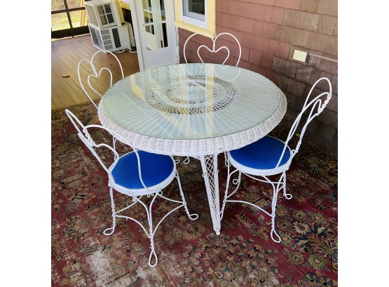 Round Wicker Table With Five Vintage Metal Chairs