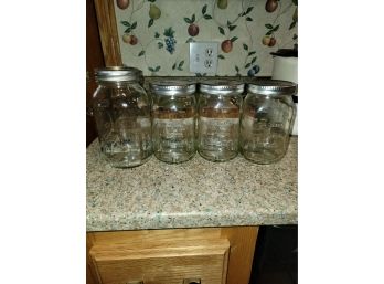Four Glass Jars