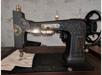 White Rotary Electric Sewing Machine On Table