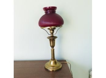 Brass Tone Lamp With Red Glass Shade