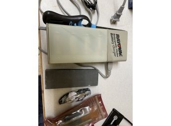 Lighters, Battery Charger, Sling Shot, And Other Items