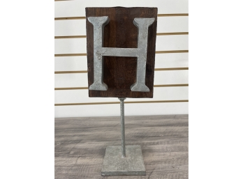 Antique Metal 'H' Mounted On Stand