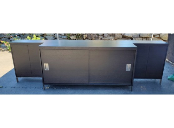 Large Black Credenza Cabinet With Sliding Doors And Two Pair Of Outer Doors.