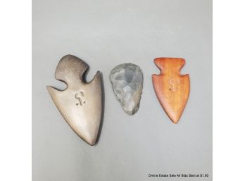 A Knapped Flint Scraper And Two (2) Wood And Bronze Arrowhead Form Collectibles