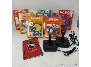 Eight (8) Atari Game Cartridges And Two (2) Wired Joystick Controllers
