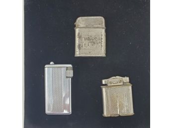 Three Vintage Lighters: Querria, Financ, 77-1