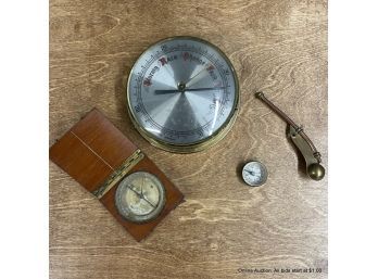 Barometer, Two Compasses, And A Bosun Whistle