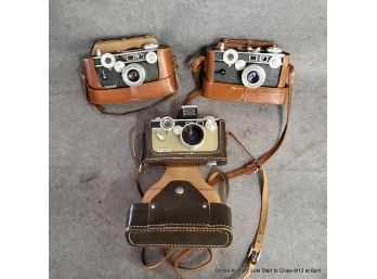 Three Argus Cameras Including Two Model C3 Each In Case With One Flash Unit
