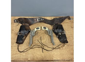 Two Gunsmoke Cap Guns With Tooled Leather Holsters