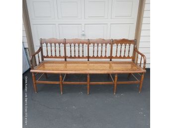 Four-seat Bench With Caned Seat And Turned Back And Stretcher With Removable Cushion.