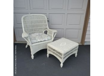 Wicker Armchair And Footstool With Cushioned Seat.