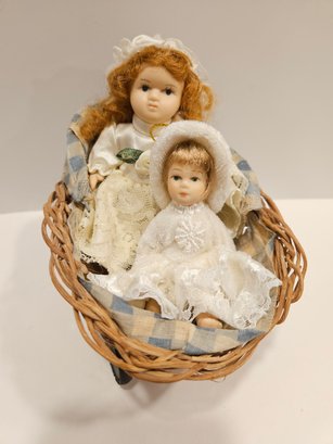 2 Mini Porcelain Dolls In Bassinet