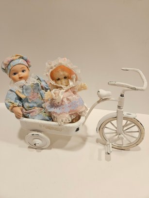 2 Mini Dolls In A Wagon