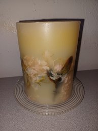 Candle With Flowers Inside Of It