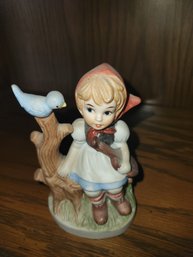 Porcelain Girl With Bird Figurine