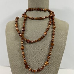 028 Thirty-four Inch Copper Toned Beaded Pearl Necklace