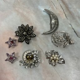 024 Lot Of Eight Silver/Rhinestone Brooches.