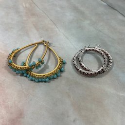 054 Lot Of Two Hoop Earrings, Gold And Silver