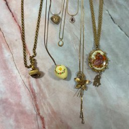061 Lot Of Seven Gold Tone Chain Necklace With Vintage Pendants