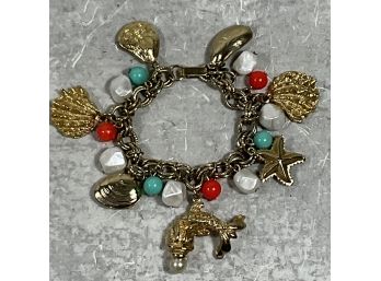 Vintage Gold Toned Sea Themed Charm Bracelet With Dolphin, Shells Clams , Oysters ( #065)