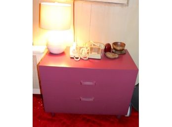 Pink Dresser With Assorted Items