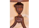 Elegant Highly Carved Pedestal Table With Brass Paw Feet On Casters