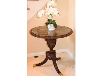 Elegant Highly Carved Pedestal Table With Brass Paw Feet On Casters