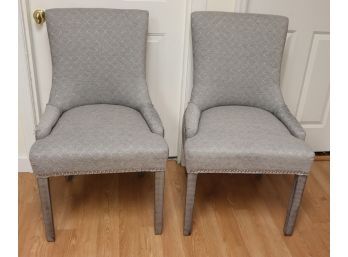 Pair Of Gray Upholstered Dining Chairs With Leather Back Handle