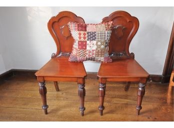 A Pair Of English Hall Chairs With Carved Shield Design On Back