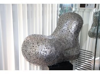 The Tongue Chair By Bannavis Andrew Sribyatta Unique Contemporary Woven Aluminum Metal Chair