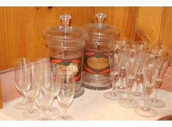 2 Glass Apothecary Jars & Assortment Of Liquor Glasses