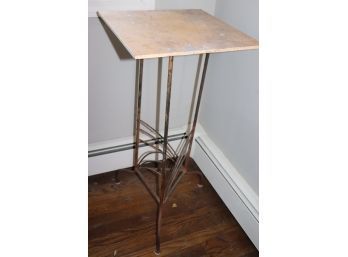 Rustic Metal Plant Stand With A Travertine Tile Top