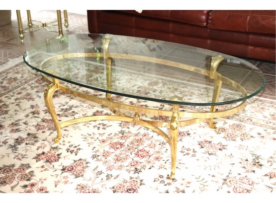Elegant Brass Cocktail Table With A Rounded Glass Edge