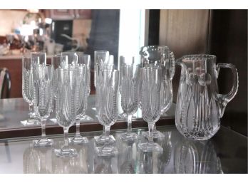 Collection Of 8 Glass Champagne Flutes With Pitcher