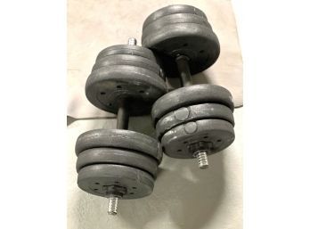 Two Sets Of Hand Weights With Six Weights On Each