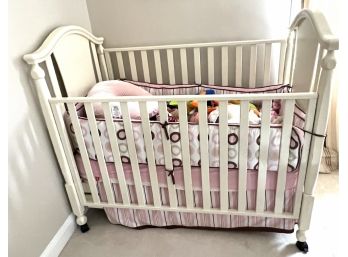 Gently Used Crib On Casters With Many Stuffed Animals