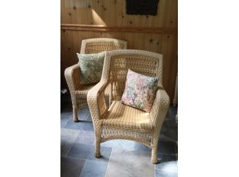 Pair Of Weather Wicker Chairs With Different Pillow Styles Great For Indoor /Outdoor