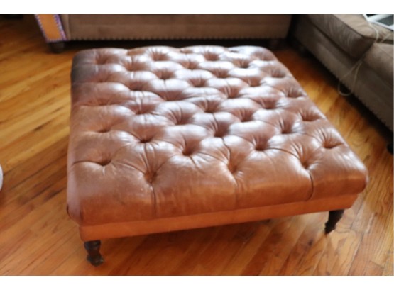 Chesterfield Style Tufted Leather Ottoman With A Weathered Look