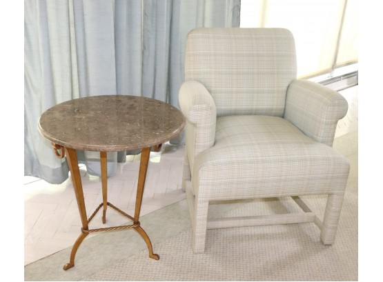 Comfortable Chair With A Marble Stone Top Sid Table With A Beveled Edge On An Ornate Gilded Finished Metal Bas