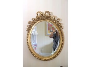Ornate Gilded Wood Mirror With A Beveled Edge & Bow Crown Approx. 24 Inches X 32 Inches