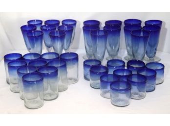 Large Set Of Hand-Blown Glasses With Blue Trim