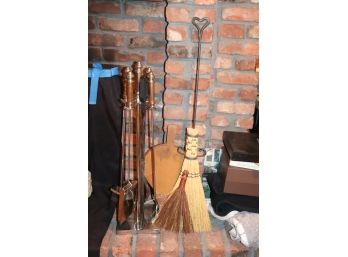 Collection Of Stainless Fireplace Tools With A Stand