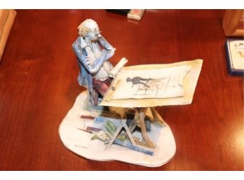 Whimsical Italian Porcelain Figurine Of Man Sitting At Drafting Table By Italinan Artist Colombo