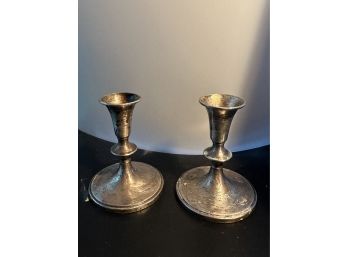 PAIR OF CARTIER STERLING WEIGHTED CANDLESTICKS