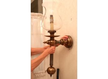 Two Brass And Glass Wall Sconces With Glass Globe