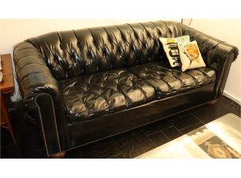 Vintage Black Leather Like Sofa With Tufted Back And Stud Trim Along Edges Tear On Arm