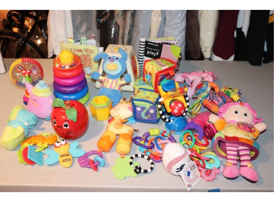 Lot Of Assorted Baby Toys Including Rattles And Dolls