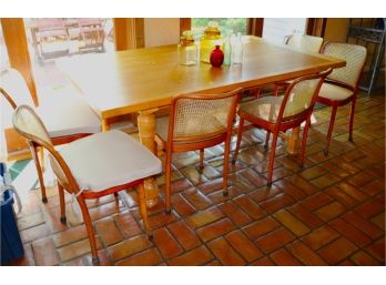 Large Pine Butcher Block Style Table With Cane Chairs And Decorative Bottles