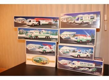 Assorted 8 Piece Collectible Hess Truck Lot Brand New!