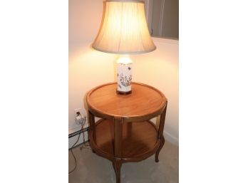 QUALITY ROUND WOOD SIDE TABLE AND PORCELAIN LAMP  WITH FLORAL MOTIF AND ASIAN WOOD BASE